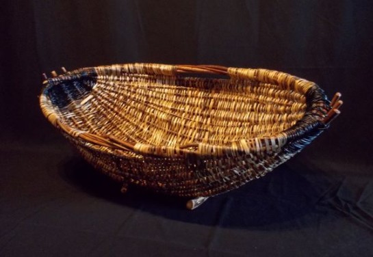 Giant Hearth Basket by Melinda West, 16"t, 40"w, 22"d, Made with split cedar limbs, bonsai wire, willows, and plum branches.